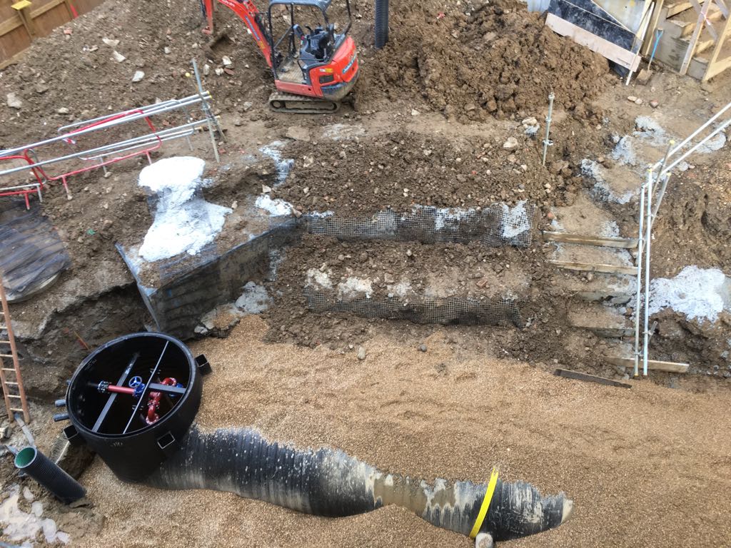  Weholite pipe system with integral pumping station, anti-slip benching, integral pipework, pump guides, pedestals and dry weather flow channel 